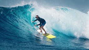 Senior surfer with white beard surfs powerful ocean wave in the Maldives on yellow longboard - Powered by Shutterstock - Get 15% off with code: PIKWIZARD15
