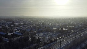 High angle view of Snow covered North Luton's landscape and Cityscape, Aerial Footage of Luton City of England UK after Snow Fall. The 1st Snow Fall of this Winter of 2022