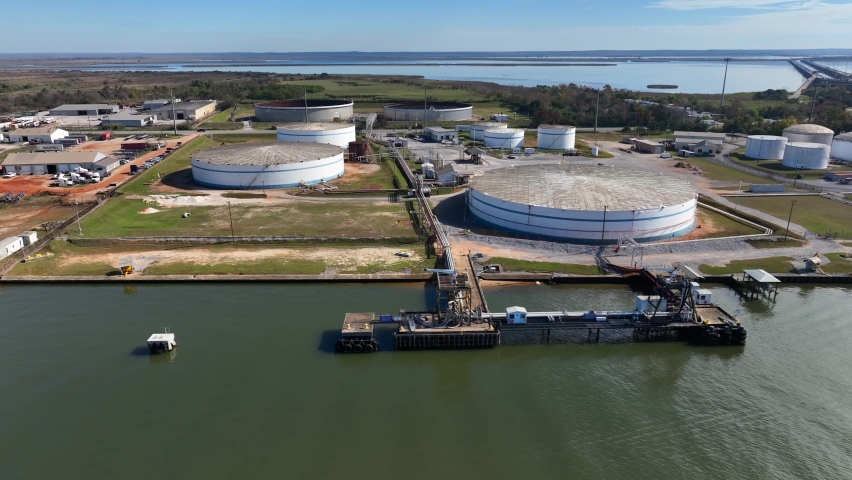 Port of Mobile Alabama with fuel tanks. Oil and gas shipment concept. Refinery storage on Gulf coast. Aerial shot.