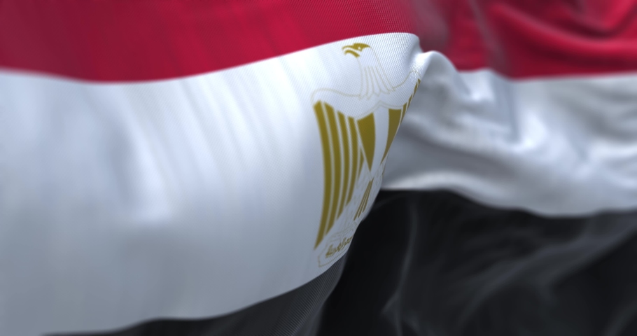Egypt national flag waving. The Arab Republic of Egypt is a country located in the northeast Africa. Fabric textured background. Selective focus. Seamless looping in slow motion. Realistic 3D render