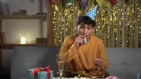 A birthday guy on his 18th birthday with gold number balloons. Excited eighteen arabic man celebrating and having fun at home. student on happy birthday. - Powered by Shutterstock - Get 15% off with code: PIKWIZARD15