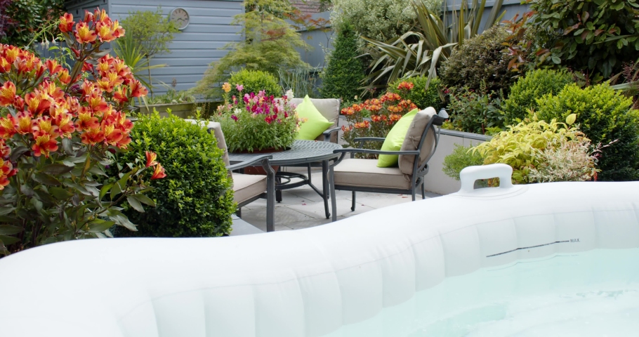 Garden inflatable hot tub, still water then air jets turned on Royalty-Free Stock Footage #1097960259