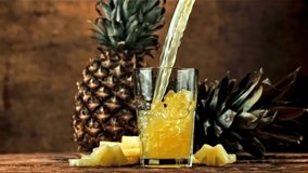 Pineapple juice is poured into a glass. Filmed is slow motion 1000 fps. High quality FullHD footage - Powered by Shutterstock - Get 15% off with code: PIKWIZARD15