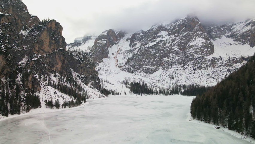 Aerial View Of Frozen Pragser Wildsee (Lake Braies) During Winter In Prags Dolomites, Tyrol, Italy. - forward
