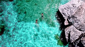 men and women snorkeling in the ocean, Praslin Seychelles tropical island with turqouse colored blue ocean - Powered by Shutterstock - Get 15% off with code: PIKWIZARD15