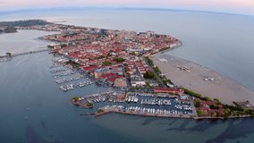 4k drone forward video (Ultra High Definition) of Grado port, small town located between Venice and Trieste. Magnificent evening seascape of Adriatic sea.