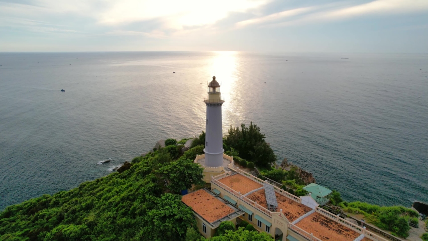 Aerial view dawn landscape at Dai Lanh lighthouse in Phu Yen, Vietnam. This is also the first place to receive the sun on the mainland of Vietnam Royalty-Free Stock Footage #1097969191