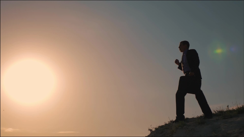 Businessman on top of success. Career people. Business success concept. Successful businessman. Winner is the path to success. Freedom and victory concept. Business victory. People are winner