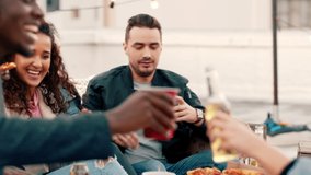 Pizza, alcohol and friends at party on rooftop for social event, celebration or birthday eating together, relax and drink. New York group of people toast wine or cheers beer with fast food lifestyle - Powered by Shutterstock - Get 15% off with code: PIKWIZARD15