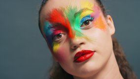 Beauty, face paint and aesthetic woman with color makeup and creative cosmetics with a perfect teeth smile for LGBTQ, pride and rainbow campaign. Portrait of England model zoom for art on skin - Powered by Shutterstock - Get 15% off with code: PIKWIZARD15