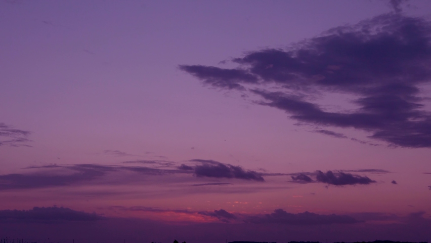 Amazing Orange Purple Sky Sun Cirrus Clouds at Sunrise. Colorful Dawn. Lilac Yellow Sunrise Skyscraper with Light Clouds and Sun. The Sun Rising from the Horizon in the Field Beautiful View 4K.
