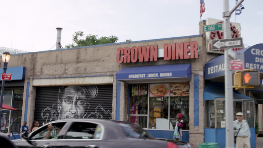 NEW YORK - JULY 12, 2015: Yankee legends, murals on storefronts, Crown Diner, in the Bronx en route to Yankee Stadium, 4K, NY. The Bronx is the northernmost borough of NYC.