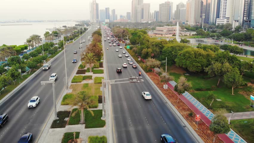 Highway with cars aerial view. Abu Dhabi traffic. Cars traffic aerial.
