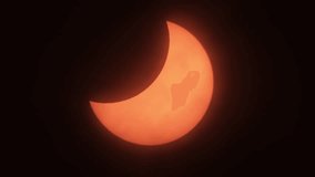 Partial Solar Eclipse When Sun Rise in Europe October 25, 2022. Movement of Clouds in Front of Sun During a Solar Eclipse. Moon Cast Shadows Covering During Partial Solar Eclipse With Clouds Moving. - Powered by Shutterstock - Get 15% off with code: PIKWIZARD15