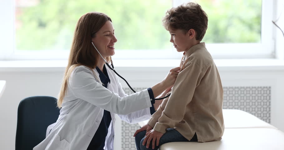 Young woman nurse use stethoscope listen to small child boy patient heart during consultation in hospital. Pediatrician or cardiologist examine little kid in clinic. Healthcare, medicine, childcare Royalty-Free Stock Footage #1098002639