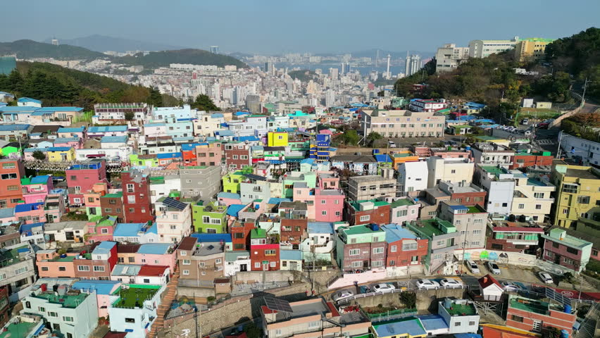 Busan: Aerial view of city in South Korea, famous Gamcheon Culture Village, kaleidoscopically coloured village on sunny day - landscape panorama of Eastern Asia from above 