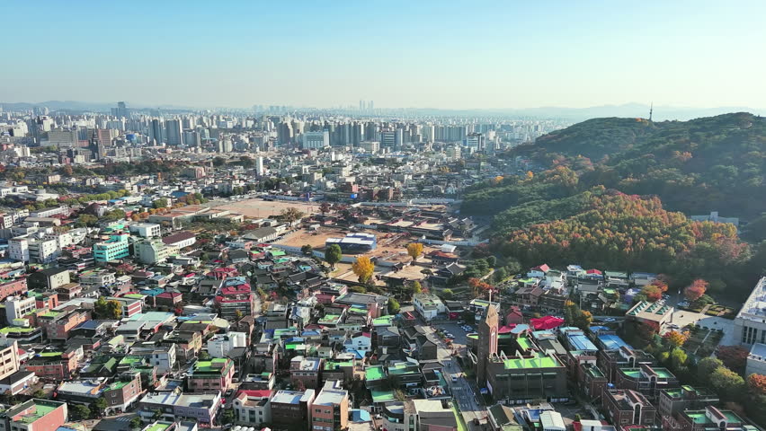 Suwon: Aerial view of city in South Korea, fortress Hwaseong Haenggung, clear blue sky - landscape panorama of Eastern Asia from above