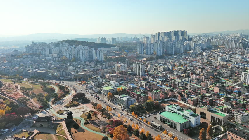 Suwon: Aerial view of city in South Korea in autumn colors, clear blue sky - landscape panorama of Eastern Asia from above
