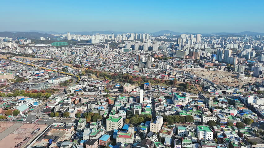 Suwon: Aerial view of city in South Korea in autumn colors, clear blue sky - landscape panorama of Eastern Asia from above