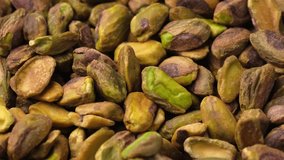 Roasted and salted Pistachios nuts, peeled. Healthy food.  Rotating video
