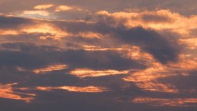 Time lapse of dark pink clouds at sunset. Rapid movement of clouds. 4k video