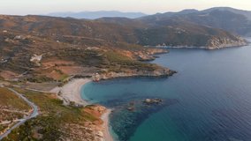 4k drone forward video (Ultra High Definition) of Cheromylos beach. Marvelous summer sunrise on Euboea island, Greece. Wonderful Aegean seascape. Beauty of nature concept background.