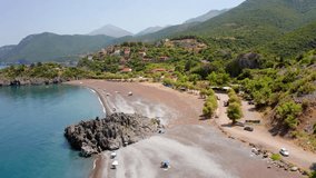 4K aerial - a bird's eye view video (Ultra High Definition) of Limnionas beach. Astonishing summer scene of Euboea island, Greece. Majestic morning seascape of Aegean sea. Vacation concept background.