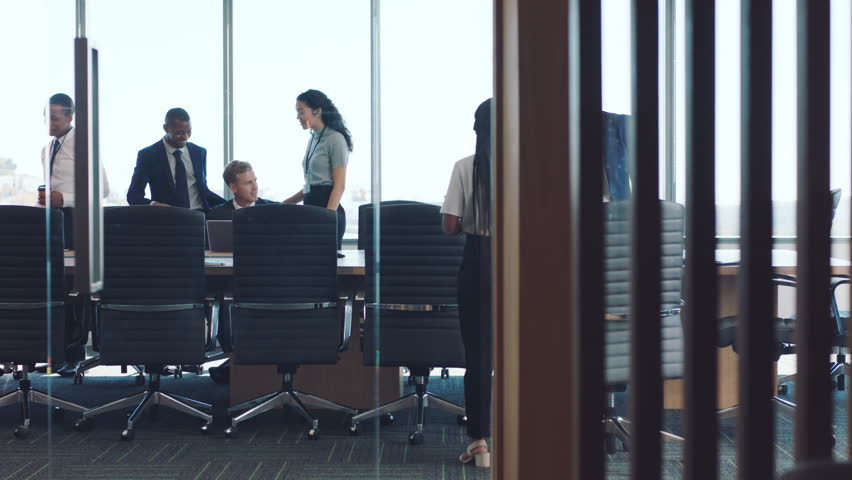 Business people, office and meeting in boardroom, conversation or group for finance, budget or seminar. Business meeting, diversity and staff in modern office, planning or teamwork for team strategy Royalty-Free Stock Footage #1098019779