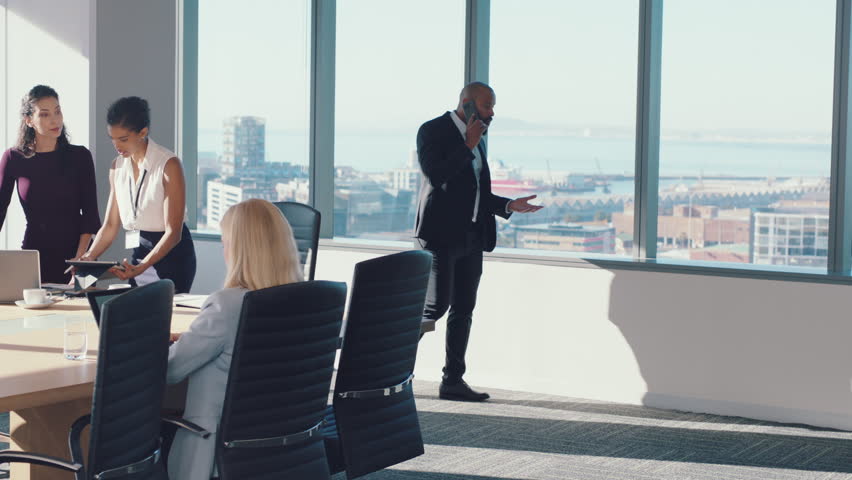 Business woman and walking in conference room with tablet for notes, planning and feedback update. Corporate employees working together on proposal at professional boardroom in New York, USA.
