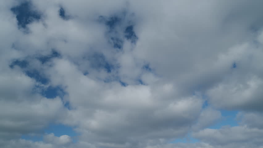 Sky with bautiful silky clouds. Puffy fluffy stratocumulus and cumulus clouds. Timelapse.