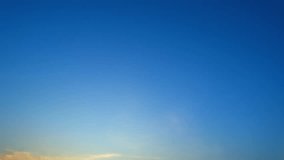 4K : Sky time lapse of colorful clouds during the moving sun. Beautiful cloud space weather beautiful blue sky background. sky from window. clouds at sunset. natural motion background
