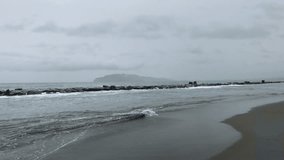 Beach in the morning with cloudy weather. waves