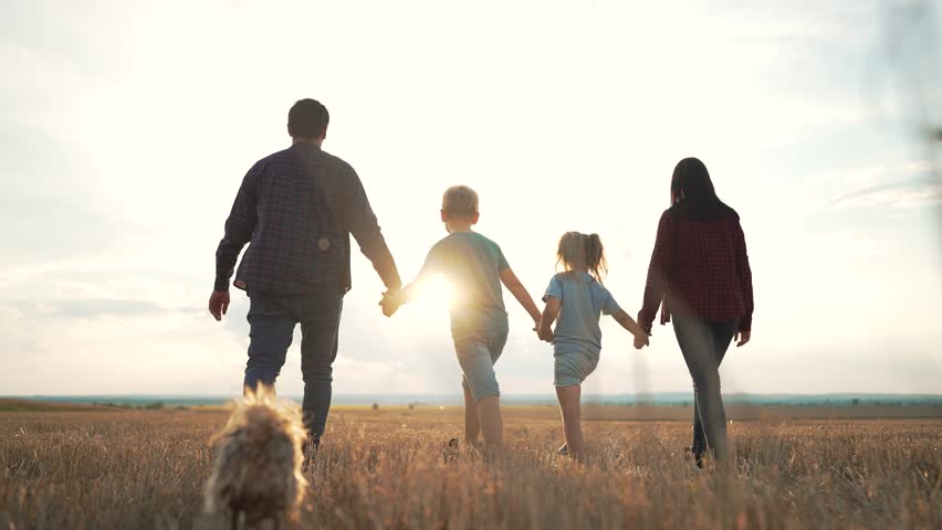 People travel in park.Happy family walk in field in nature. happy family active lifestyle. Summer walk in park at sunset. Parents and children. Happy children of family. Summer travel go everywhere. Royalty-Free Stock Footage #1098034437