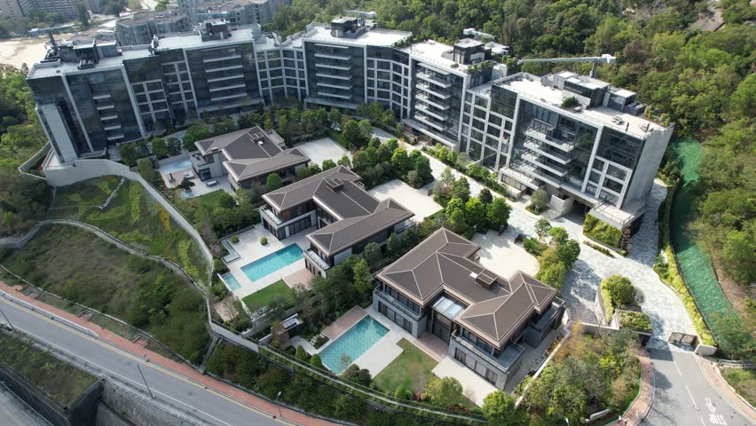 City Skyview in Hong Kong 4K Aerial drone shot of the Premium Villa independent house and residential area in Kowloon Tong Peninsula near Lion Rock, Victoria Harbour Financial Central District