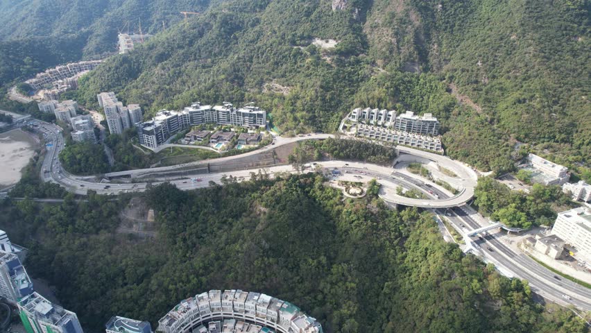 City Skyview in Hong Kong 4K Aerial drone shot of the Premium Villa independent house and residential area in Kowloon Tong Peninsula near Lion Rock, Victoria Harbour Financial Central District