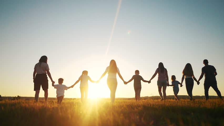 community large family in the park. a large group of people holding hands walking silhouette on nature sunset in the park. big family kid dream concept lifestyle. people in the park. large family Royalty-Free Stock Footage #1098035531