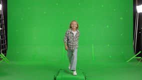happy Caucasian child walking or running on a Green Screen, Chroma Key. 4k UHD front view video. - Powered by Shutterstock - Get 15% off with code: PIKWIZARD15