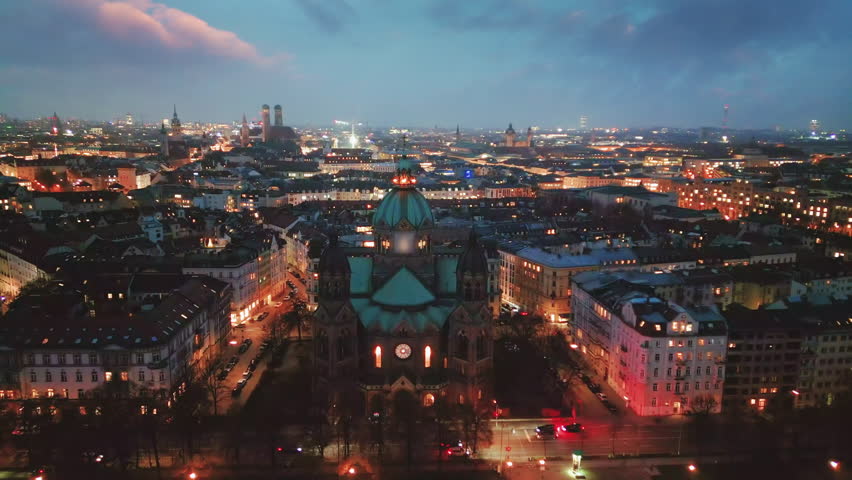 Munich aerial drone skyline view at night, munich germany nigh view city centre downtown river isar church cathedral  marienplatz sqaure frauenkirche. Royalty-Free Stock Footage #1098060945