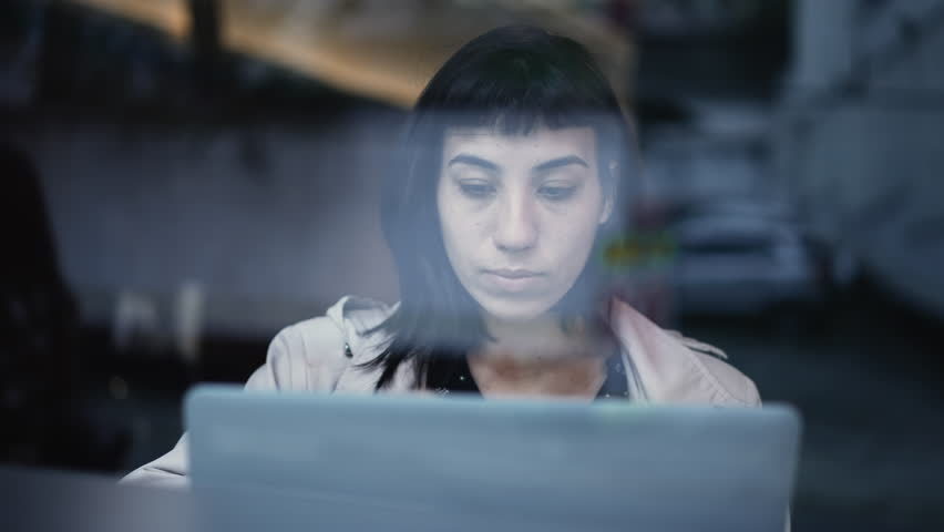 South American young woman thinking of an idea while working in front of laptop. A Brazilian adult girl having eureka breakthrough at business workplace Royalty-Free Stock Footage #1098062935