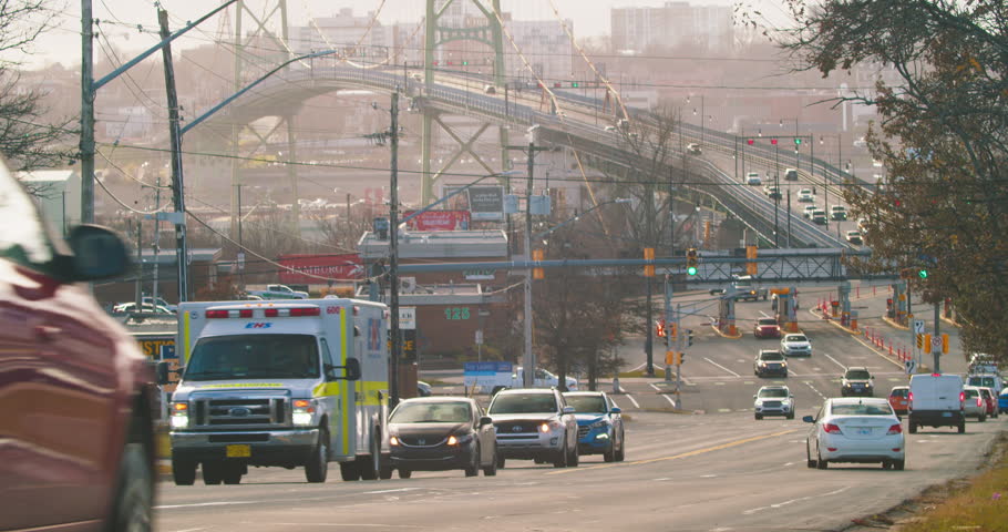 Time lapse of cars driving on the bridge and crossroads in the city of Halifax. Canada. 