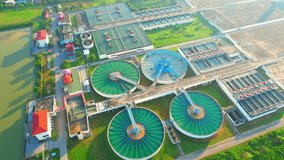 Aerial view from a drone flying over a wastewater treatment plant, water purification process to remove chemicals and contaminants. wastewater treatment are clean and Infrastructure concept. 4K
