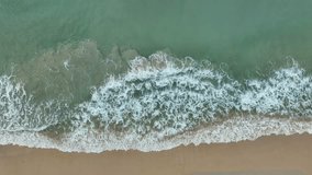 Texture of sea waves water surface, Dynamic shot Aerial view of colorful sea surface, Beautiful beach sea surface seashore, Amazing nature and travel background