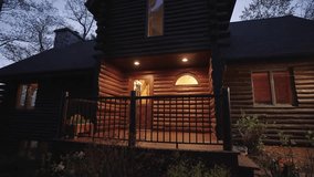 Exterior of a beautiful luxurious wooden lakeside cabin in the woods in the evening - Powered by Shutterstock - Get 15% off with code: PIKWIZARD15