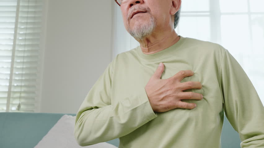 Asian older man have congenital disease suffering from heartache alone at home, Senior man bad pain hand touching chest having heart attack, Old age retirement health problems unhealthy diseased Royalty-Free Stock Footage #1098081719