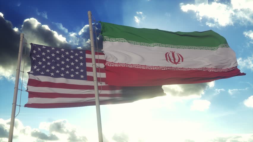 Iran and USA flag on flagpole. Iran and United States waving flag in wind. Iran and USA diplomatic concept