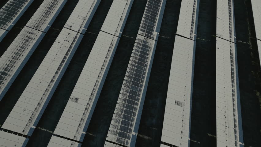Solar panels of solar power plant covered in snow and ice, partly defrosted, orbit drone shot Royalty-Free Stock Footage #1098094539