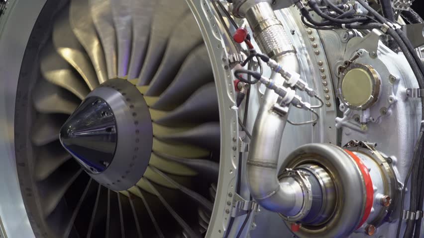 A close-up view of an aircraft jet engine turbine. 
Rotating turbine blades of turbo jet engine for plane. Аircraft concept, aviation and aerospace industry.
Large jet engine component detail. Royalty-Free Stock Footage #1098099201