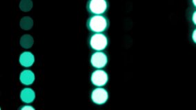 Round turquoise bokeh lines move vertically. Abstract moving background with natural lens flare effect of blurry particles and light leaks, Can be used as background, screen or overlay. Loop 4K video.