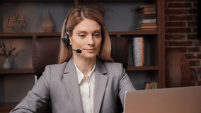 Young confident business woman make conference call in office, smart female manager talk look at camera laptop communicating in online video chat, distance job interview concept, webcam view. 
