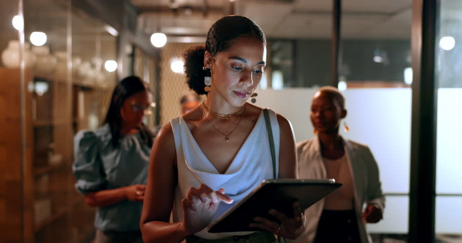 Tablet, team and black woman in office walking to business meeting doing research, online and using internet. Teamwork, leadership and group of busy female workers together in corporate workplace Royalty-Free Stock Footage #1098105589